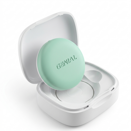 Nestories FeverWatch wearable baby thermometer with mint green sensor in an open white charging case